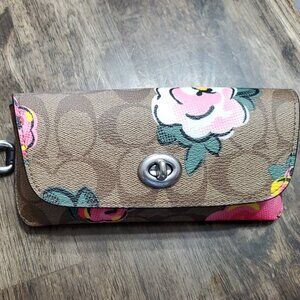 Coach sunglass case brand new without tags. Never used. Flower design.